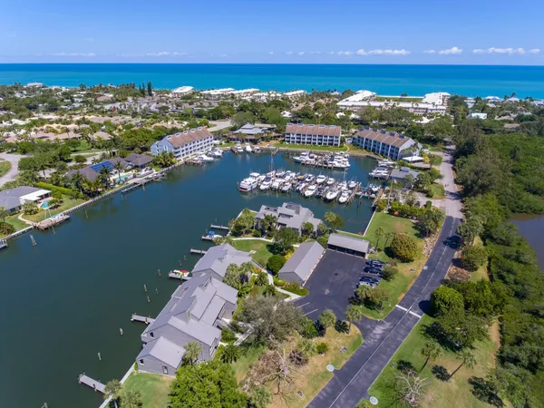 a building outdoor space with patio furniture and potted plants