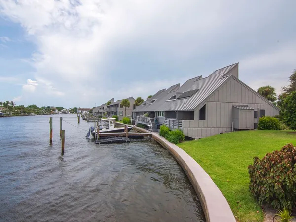 a view of a house with a flower garden