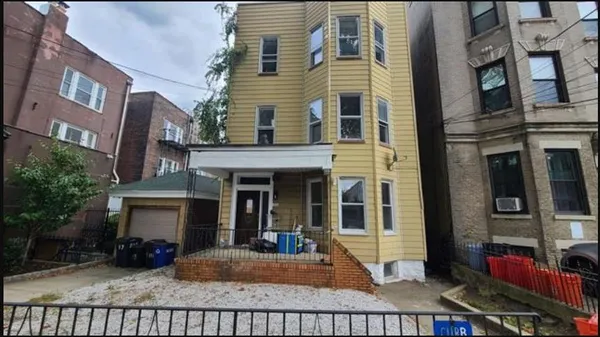 a view of a building with a porch