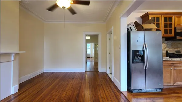 a view of a hallway view with wooden floor and staircase