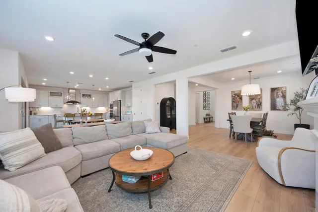 a kitchen with granite countertop counter space a dining table and stainless steel appliances