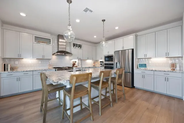 a utility room with sink dryer and washer