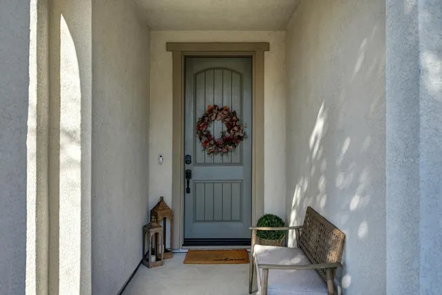 a view of a dining room with furniture and chandelier