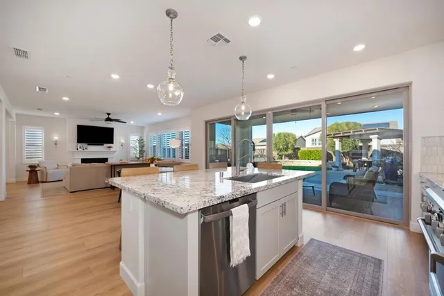 a spacious bedroom with a large bed and a flat screen tv