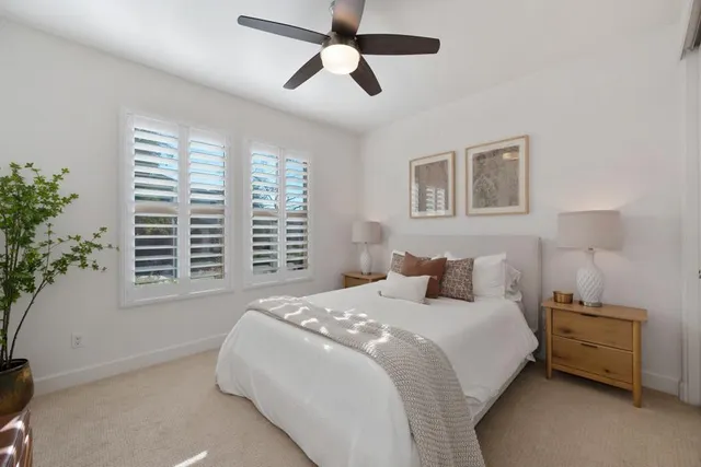 a bathroom with a granite countertop sink mirror and shower