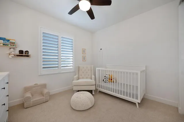 a bathroom with a granite countertop sink double and mirror