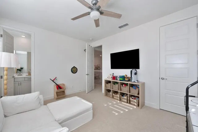 a view of a patio with table and chairs potted plants with wooden floor
