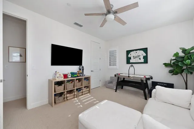 a front view of a house with a yard fire pit and outdoor seating