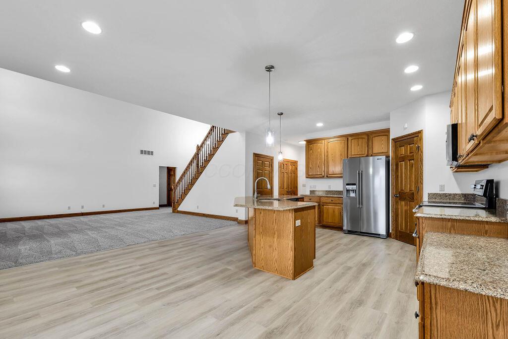 330 Longshore Road Sunbury, OH 43074 - Photo 13 of 73 kitchen is open to eating area, Great room and 4 season room.