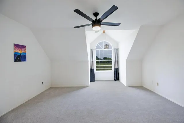 a view of a porch with furniture and garden