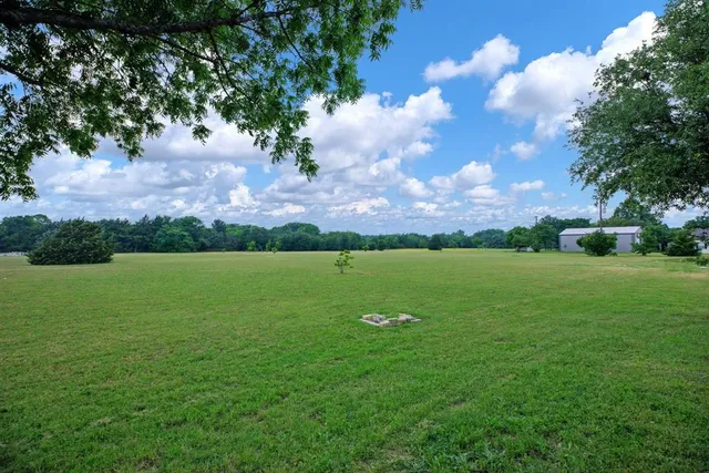 a view of a hallway with wooden shelves