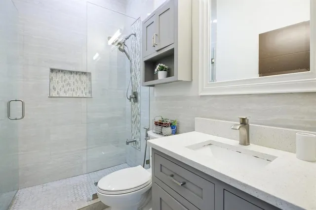 a large kitchen with a table and chairs