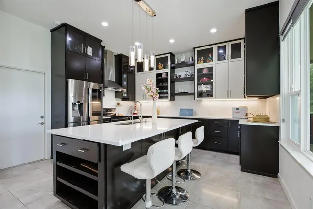 a bedroom with a bed couch and window