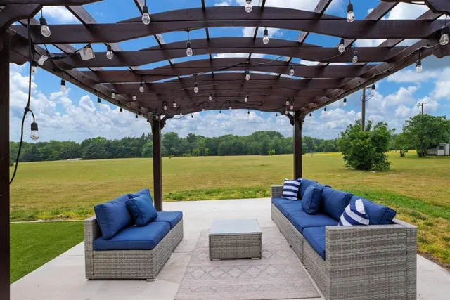 a view of a lake with houses in the back