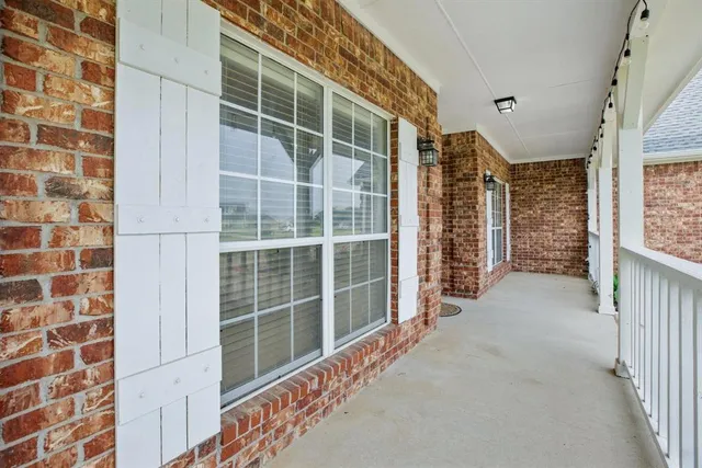 a view of a livingroom with wooden floor and staircase
