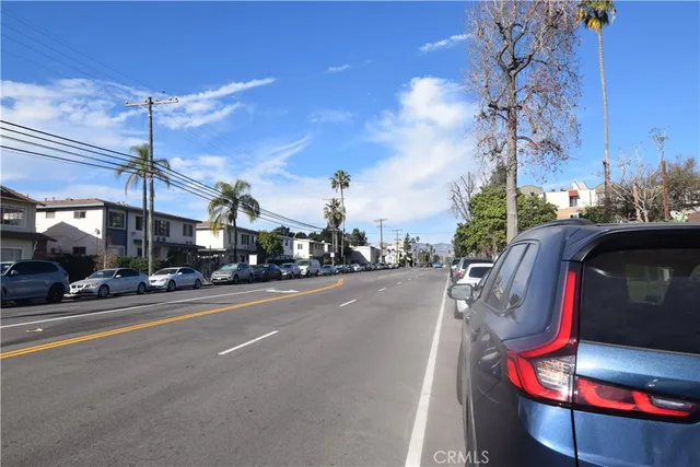a view of a street with cars