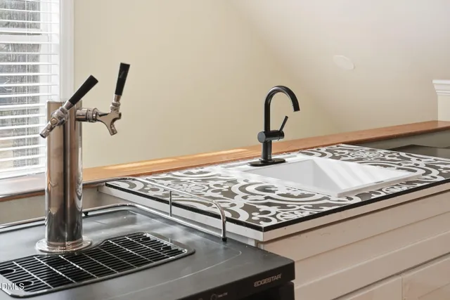 a view of a house with a backyard and a tree