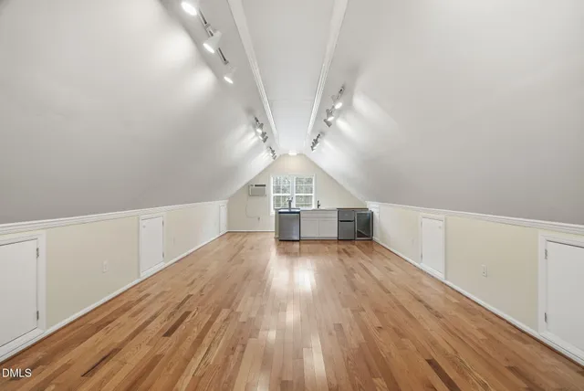 a view of a house with a parking area