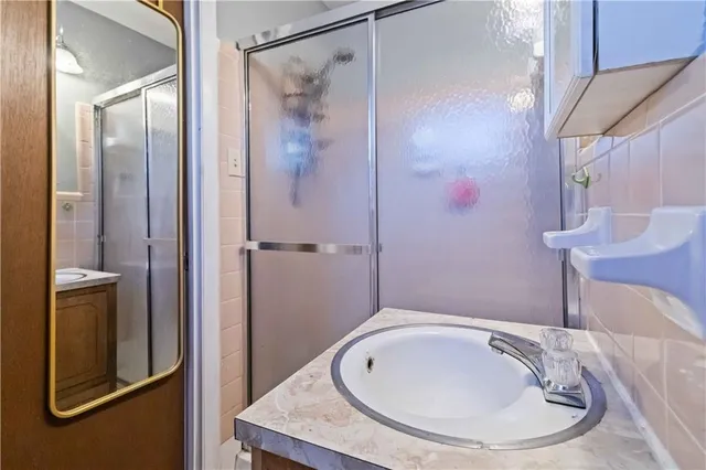 a bathroom with a bathtub and shower