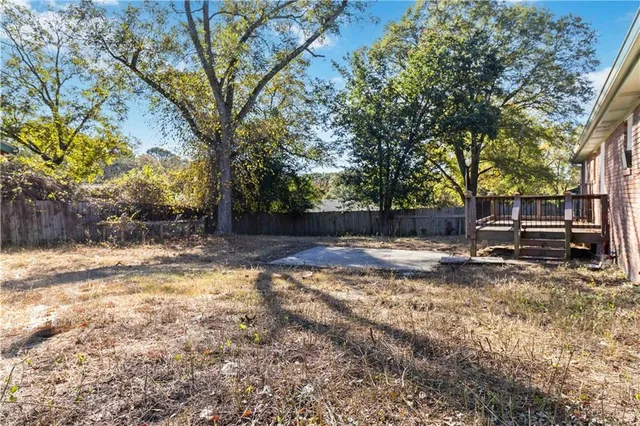 a view of a yard with a tree