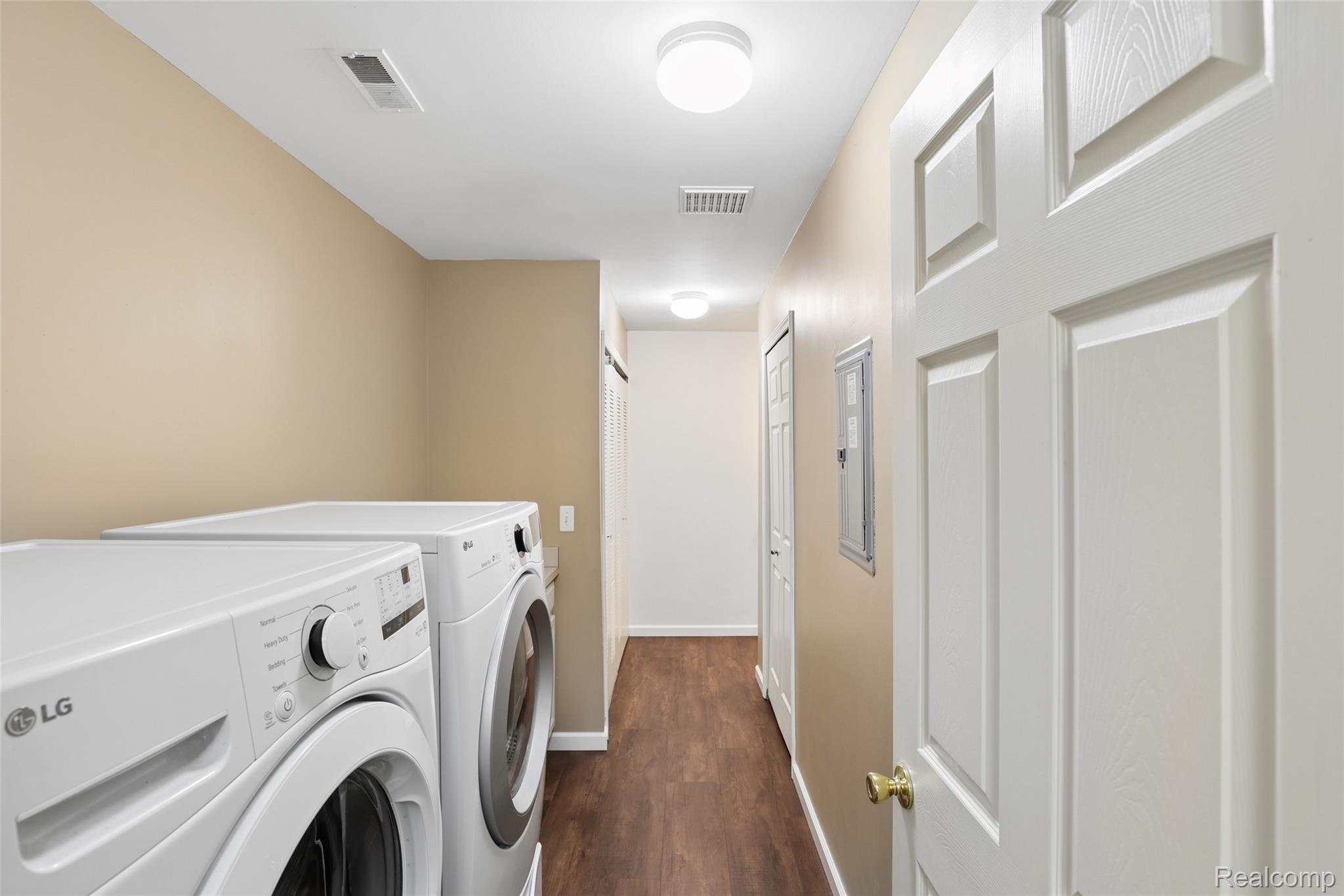 11862 Farmington Road Livonia, MI 48150 - Photo 10 of 29 Dedicated laundry area featuring wood-finish flooring, neutral wall tones, and recessed lighting