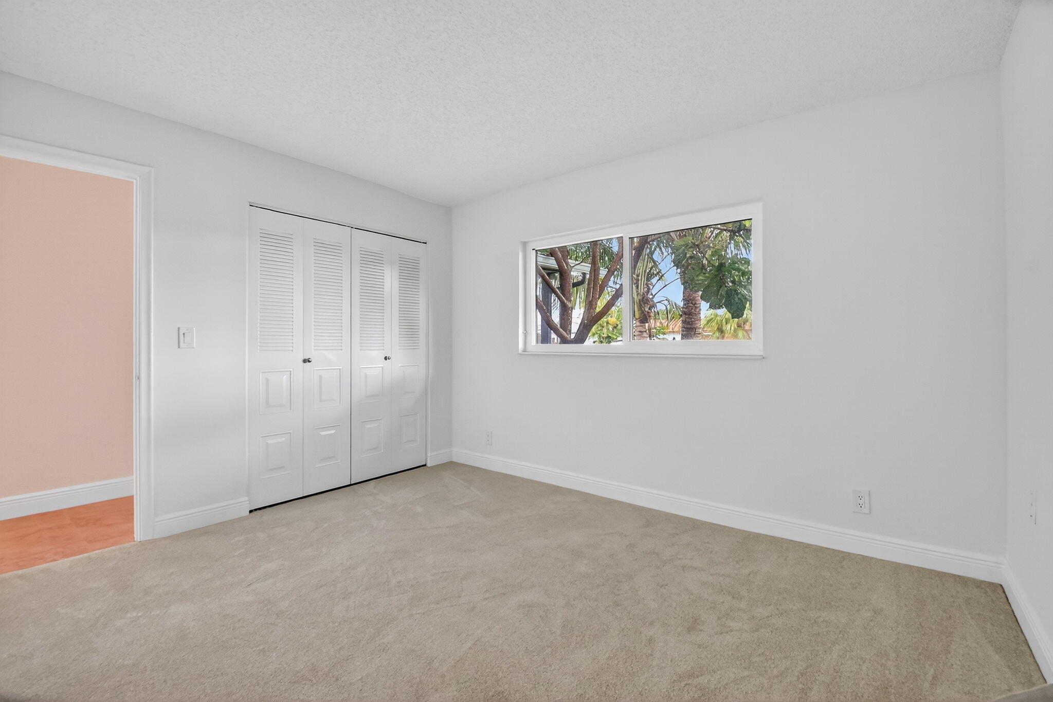 6096 Dusenburg Road Delray Beach, FL 33484 - Photo 15 of 28 a view of an empty room with a window
