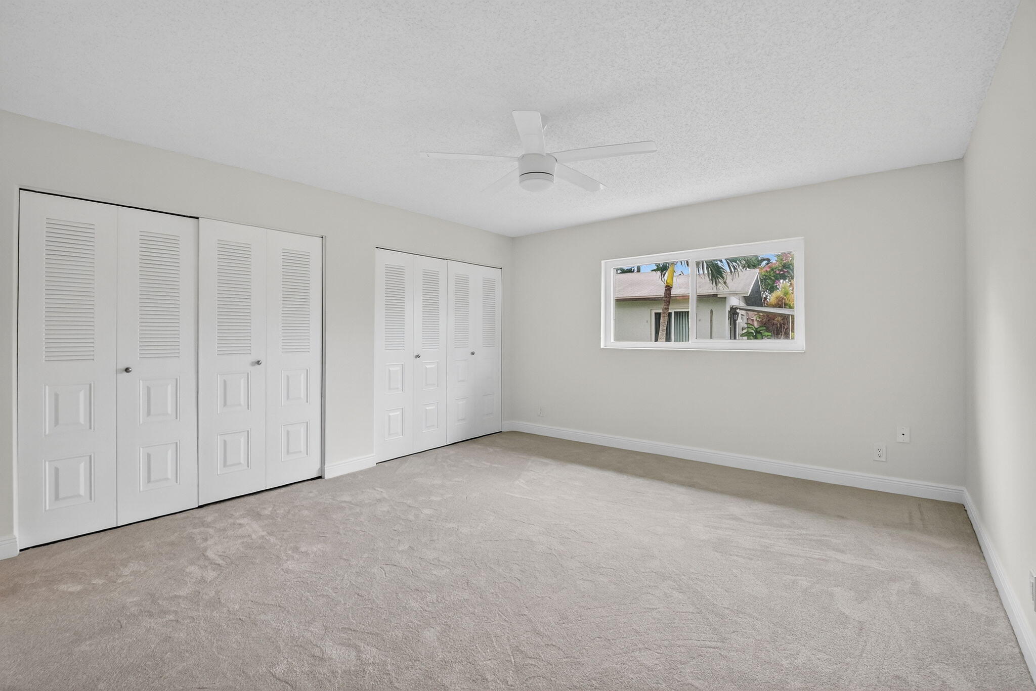 6096 Dusenburg Road Delray Beach, FL 33484 - Photo 18 of 28 a view of an empty room with a window