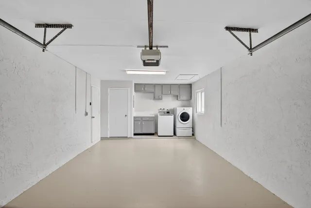 a view of a storage & utility room with washer and dryer