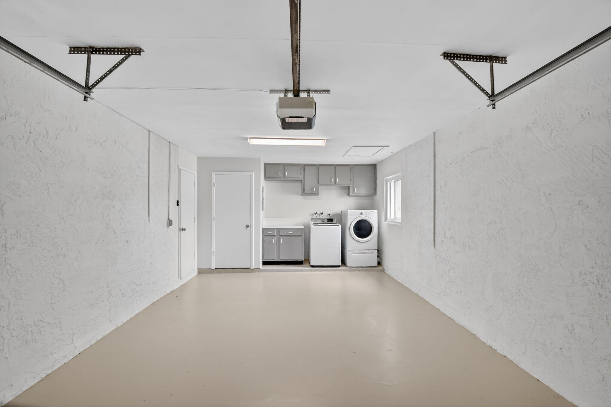 6096 Dusenburg Road Delray Beach, FL 33484 - Photo 26 of 28 a view of a storage & utility room with washer and dryer