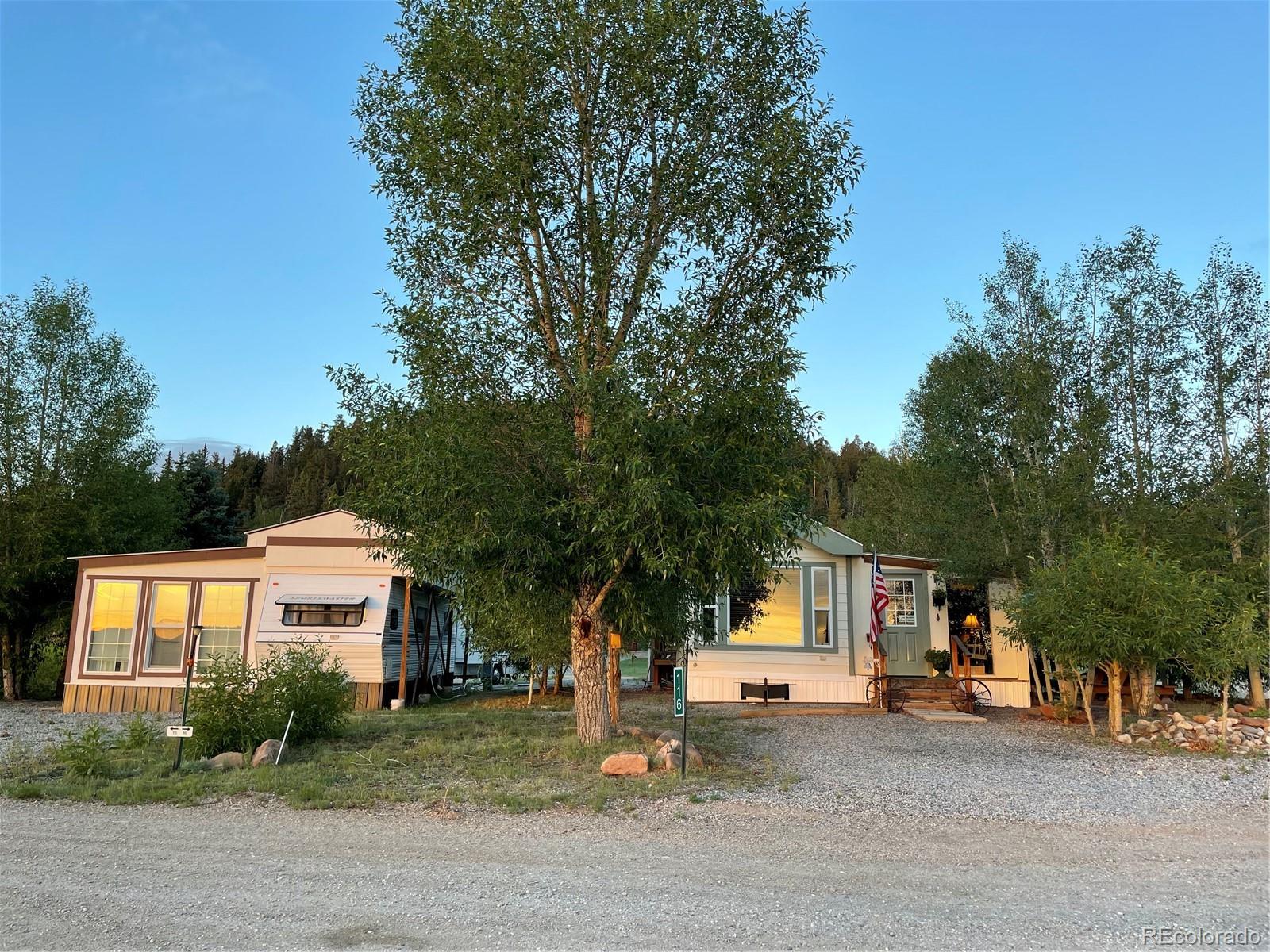 124 Clubcar Road Fairplay, CO 80440 - Photo 1 of 12 a view of a house with a street and a tree