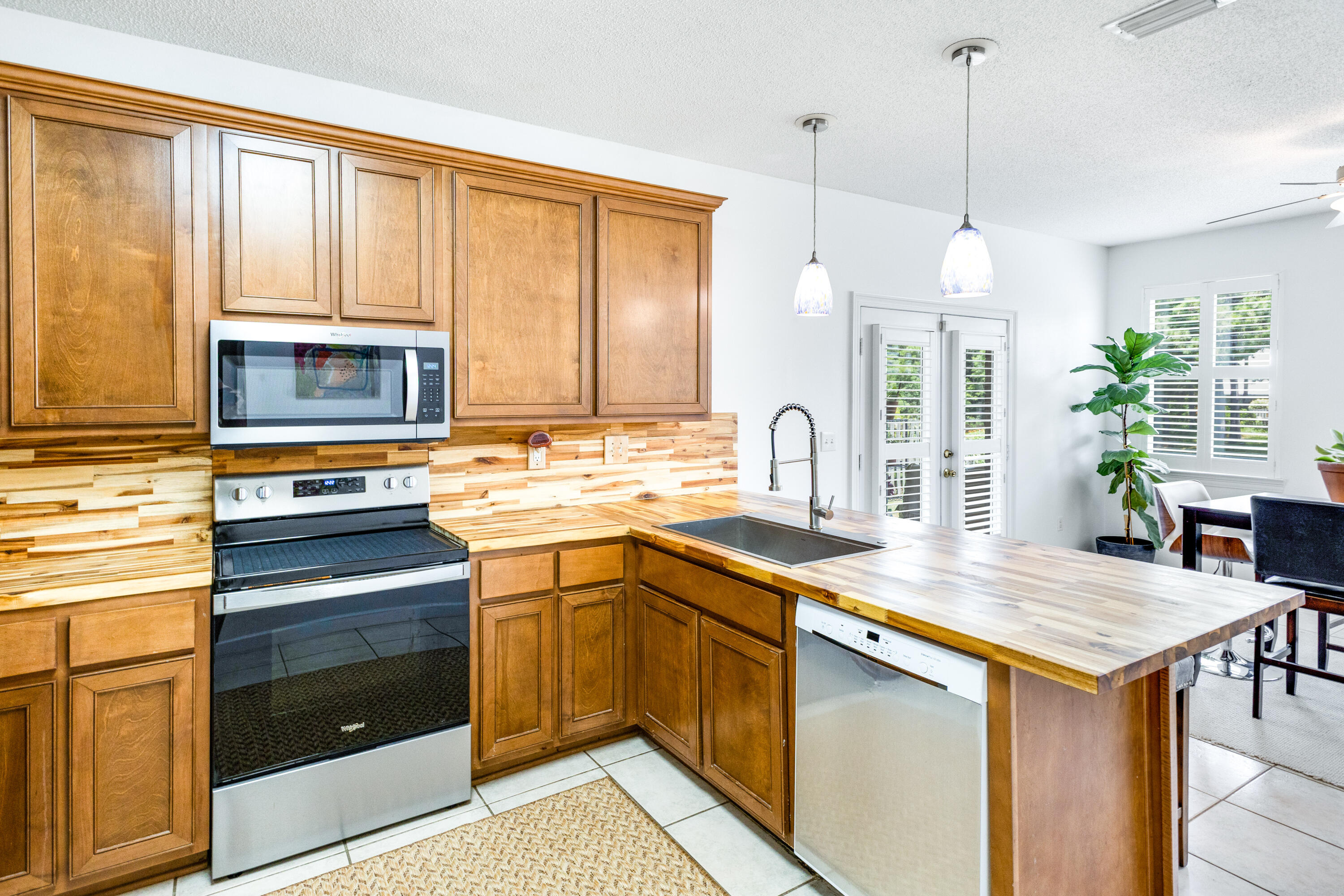 12 Corte Lago Santa Rosa Beach, FL 32459 - Photo 13 of 59 a kitchen with a stove a sink and a microwave