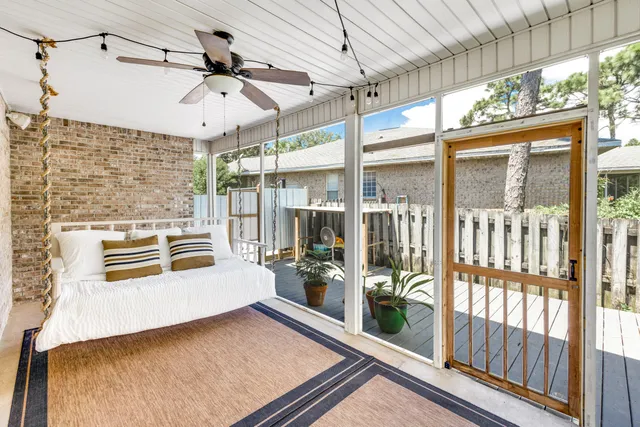 a living room with furniture a rug and a window