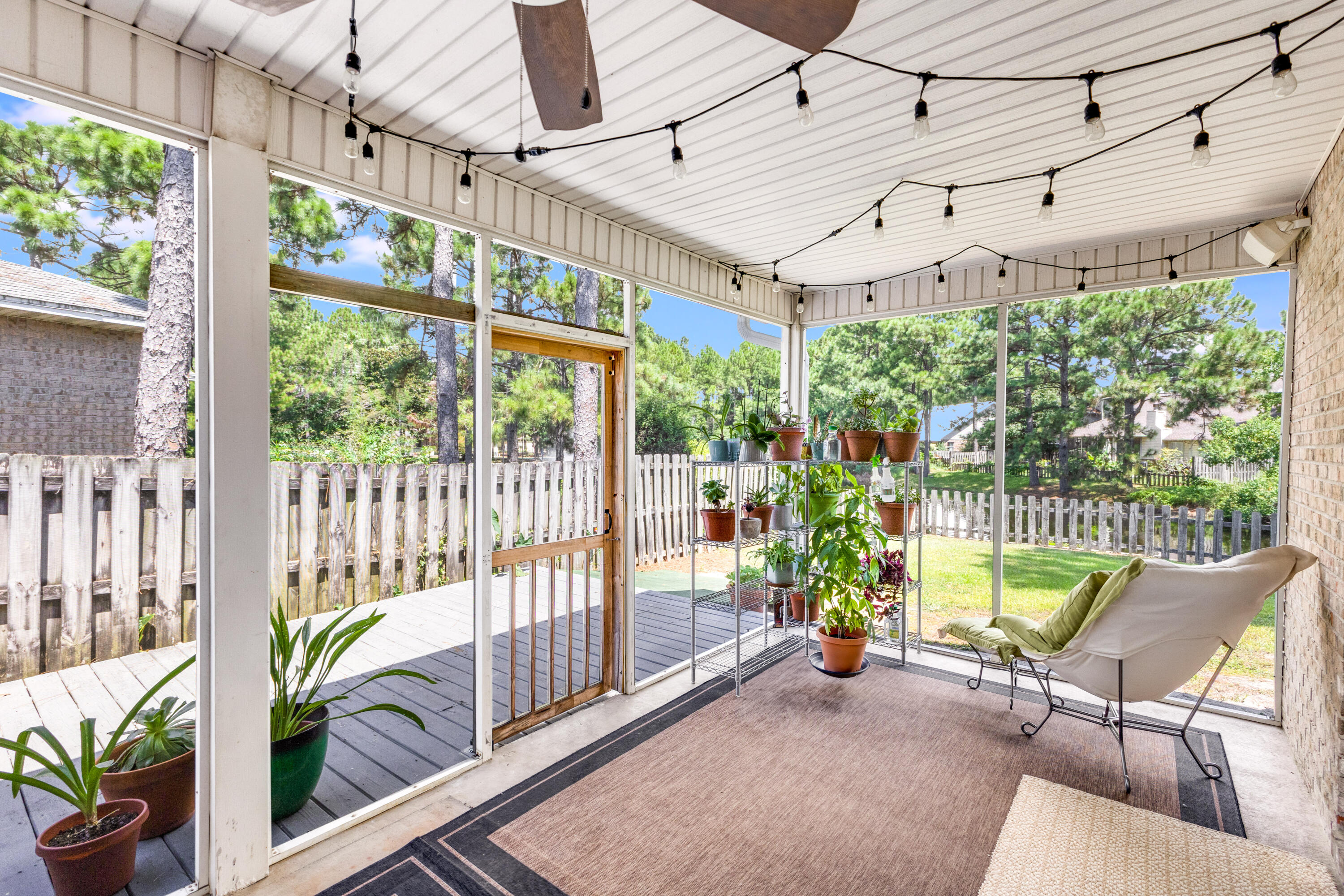 12 Corte Lago Santa Rosa Beach, FL 32459 - Photo 18 of 59 a view of a porch with furniture and a yard