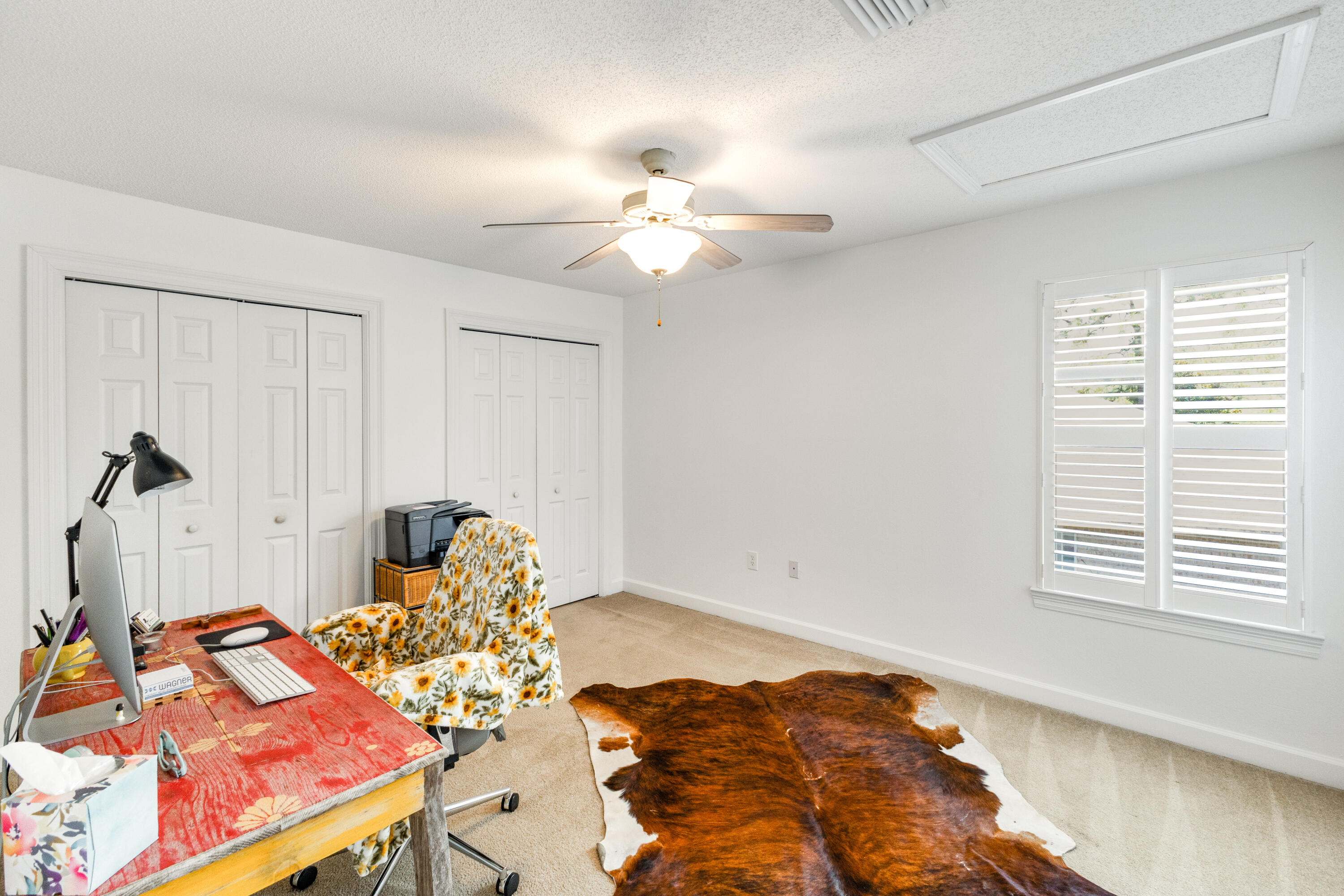 12 Corte Lago Santa Rosa Beach, FL 32459 - Photo 20 of 59 a bedroom with a bed and a chandelier