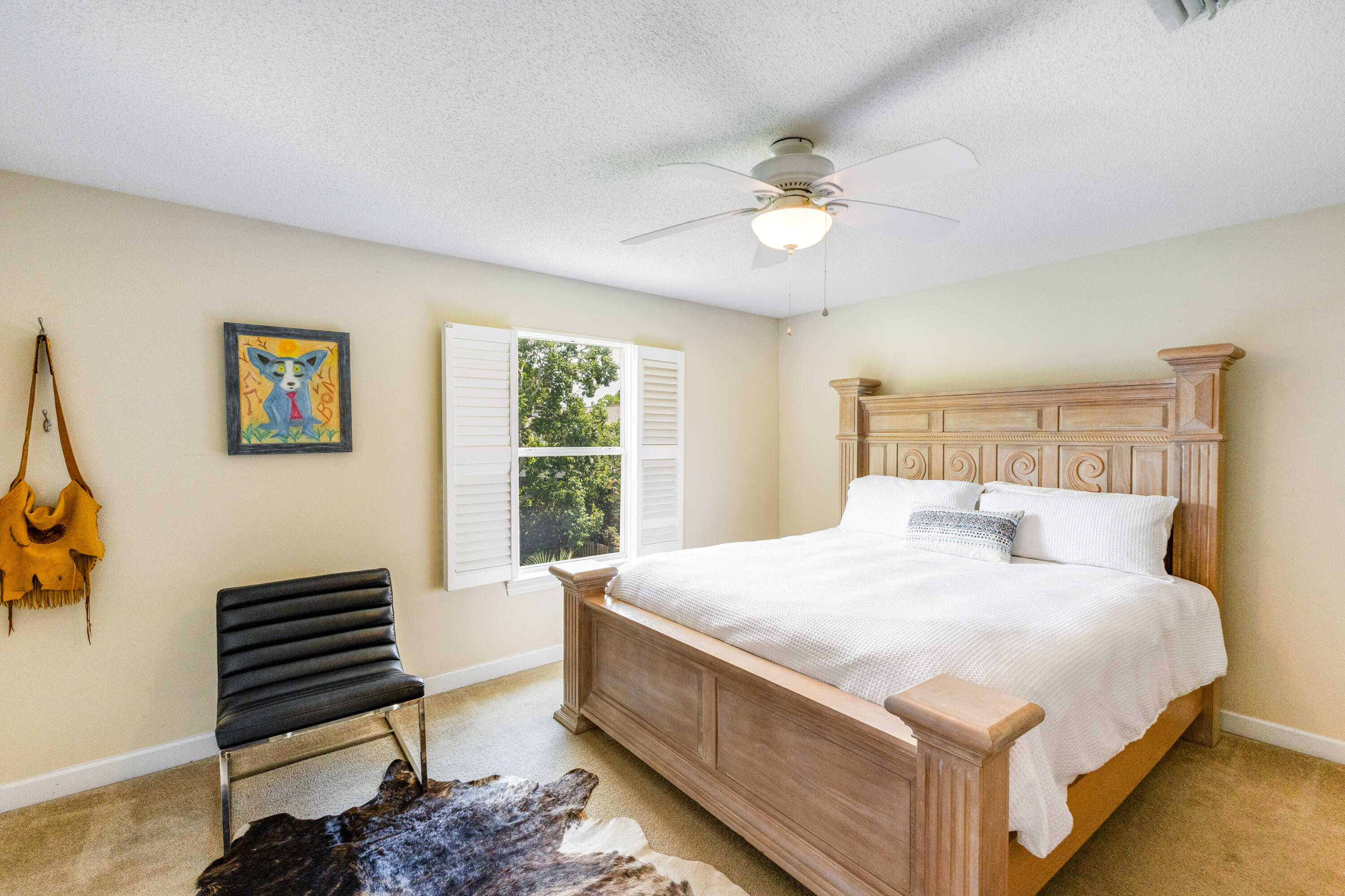 12 Corte Lago Santa Rosa Beach, FL 32459 - Photo 21 of 59 a bedroom with a bed and a chandelier