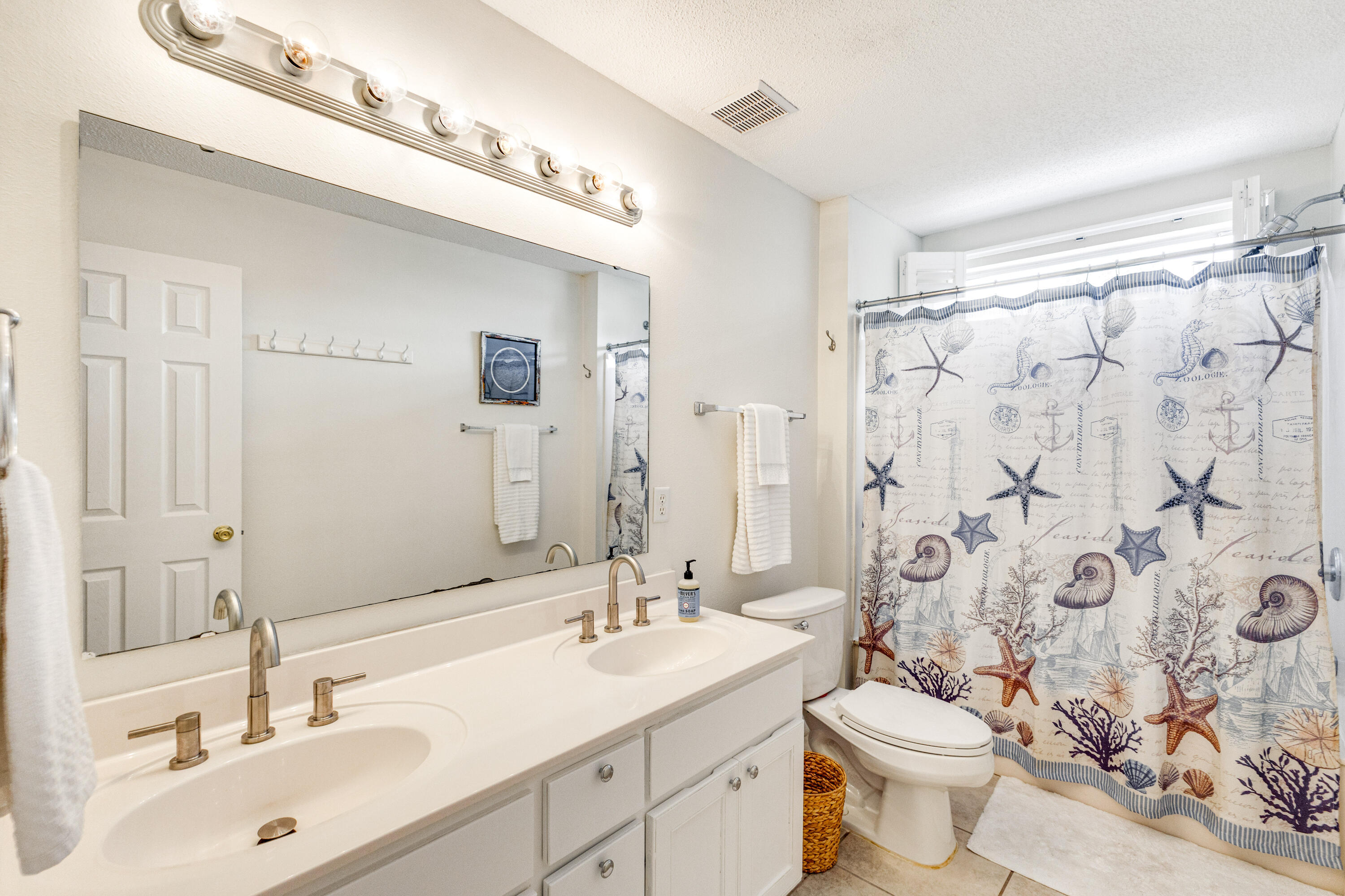 12 Corte Lago Santa Rosa Beach, FL 32459 - Photo 23 of 59 a bathroom with a double vanity sink toilet and shower