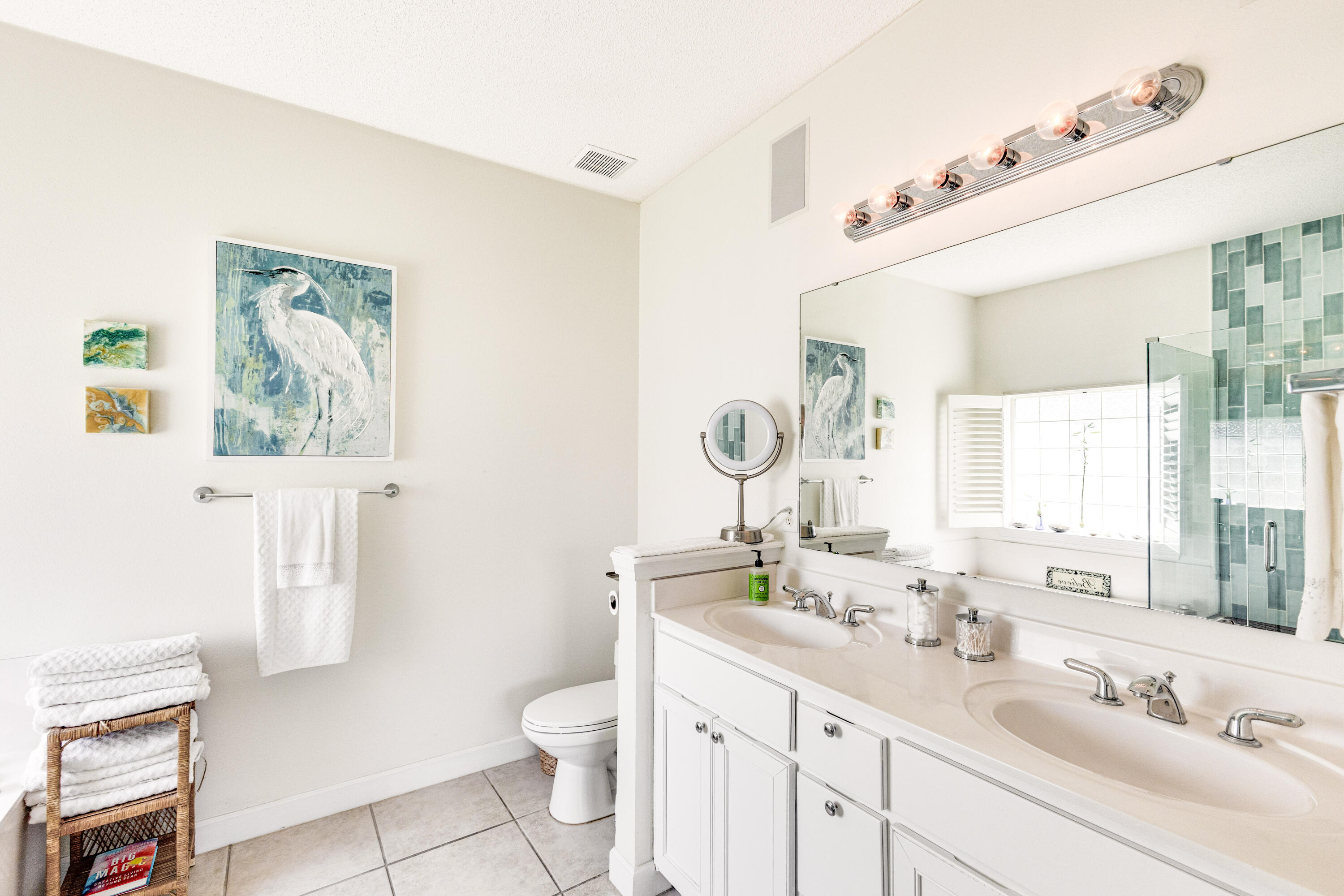 12 Corte Lago Santa Rosa Beach, FL 32459 - Photo 28 of 59 a bathroom with a sink a toilet and a mirror