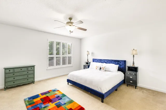 a bedroom with furniture and a chandelier