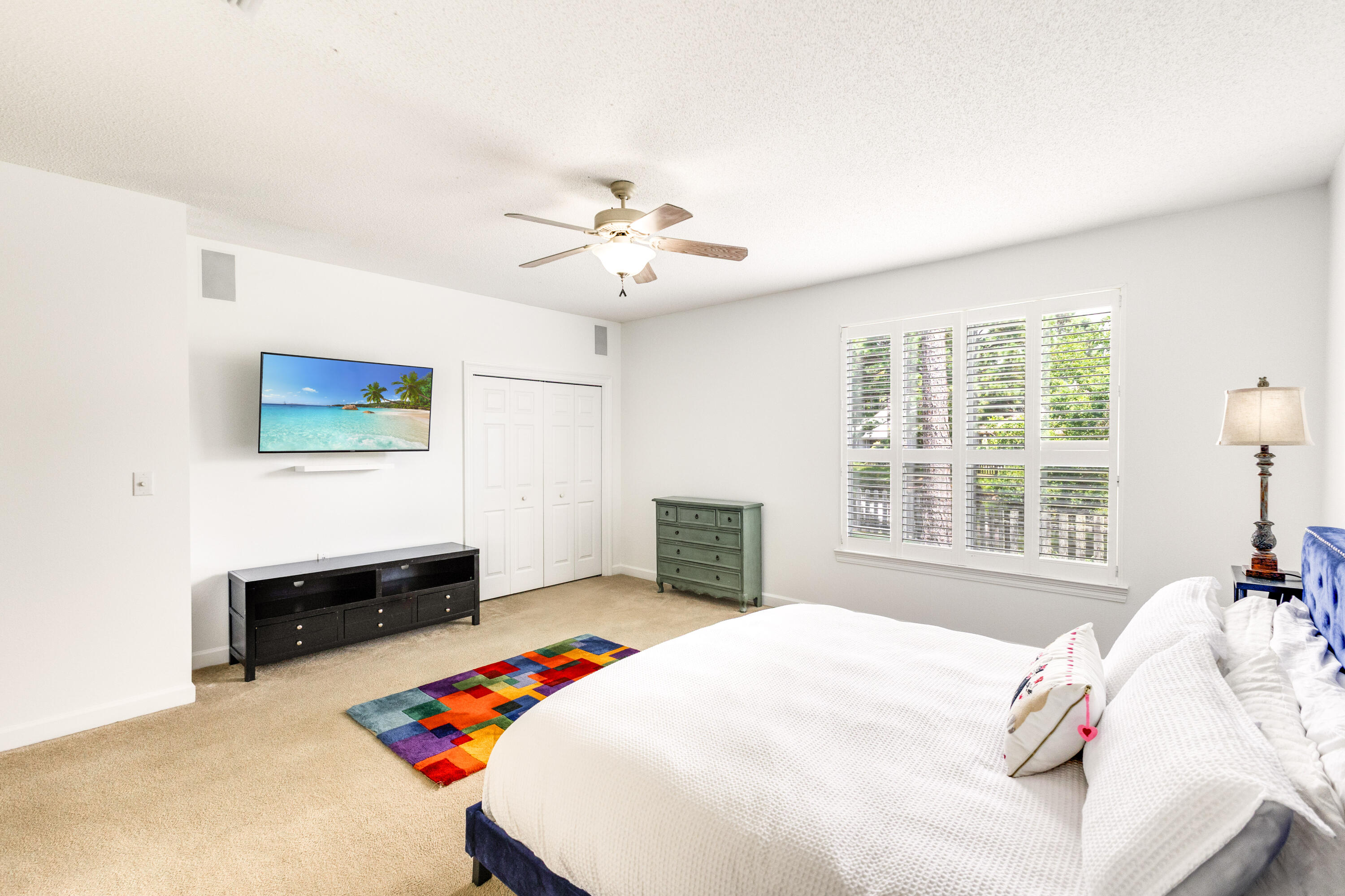 12 Corte Lago Santa Rosa Beach, FL 32459 - Photo 30 of 59 a bedroom with a bed and a chandelier