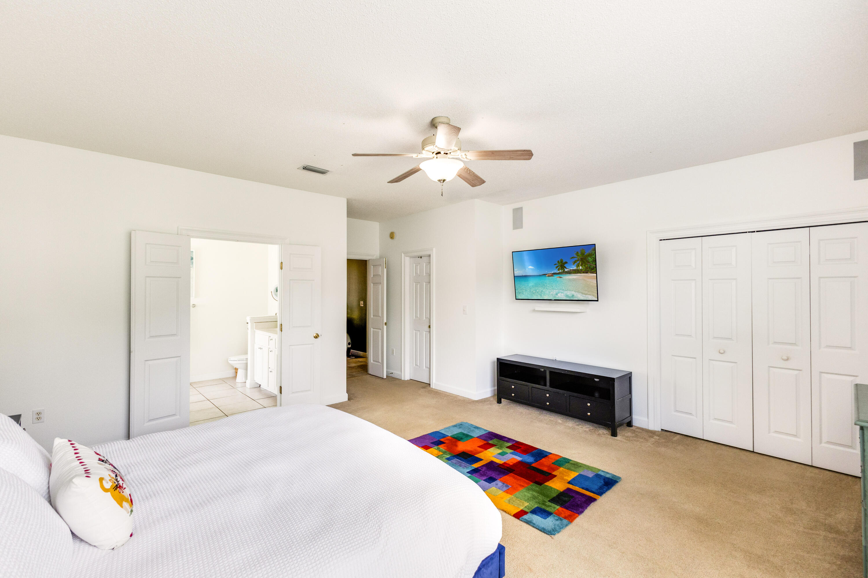 12 Corte Lago Santa Rosa Beach, FL 32459 - Photo 31 of 59 a bedroom with furniture and a chandelier