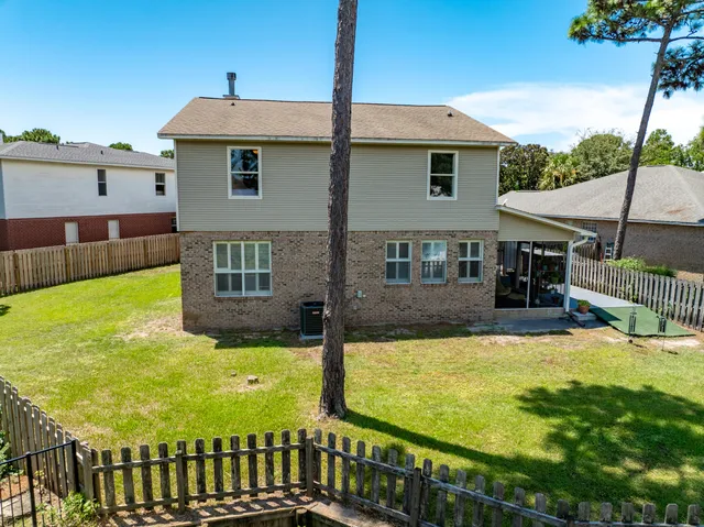a view of a patio with chairs and tables