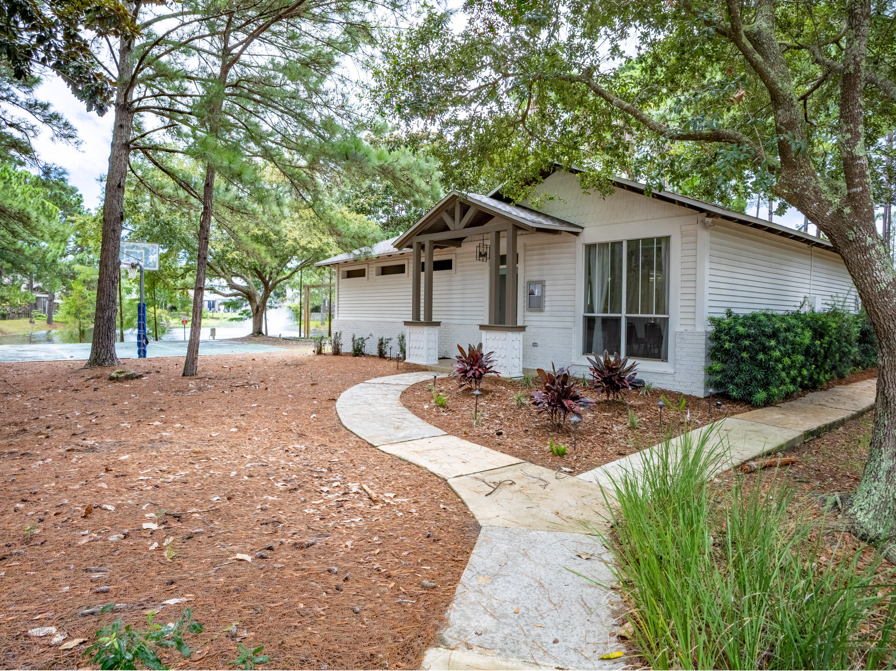 12 Corte Lago Santa Rosa Beach, FL 32459 - Photo 43 of 59 a view of a house with backyard and trees