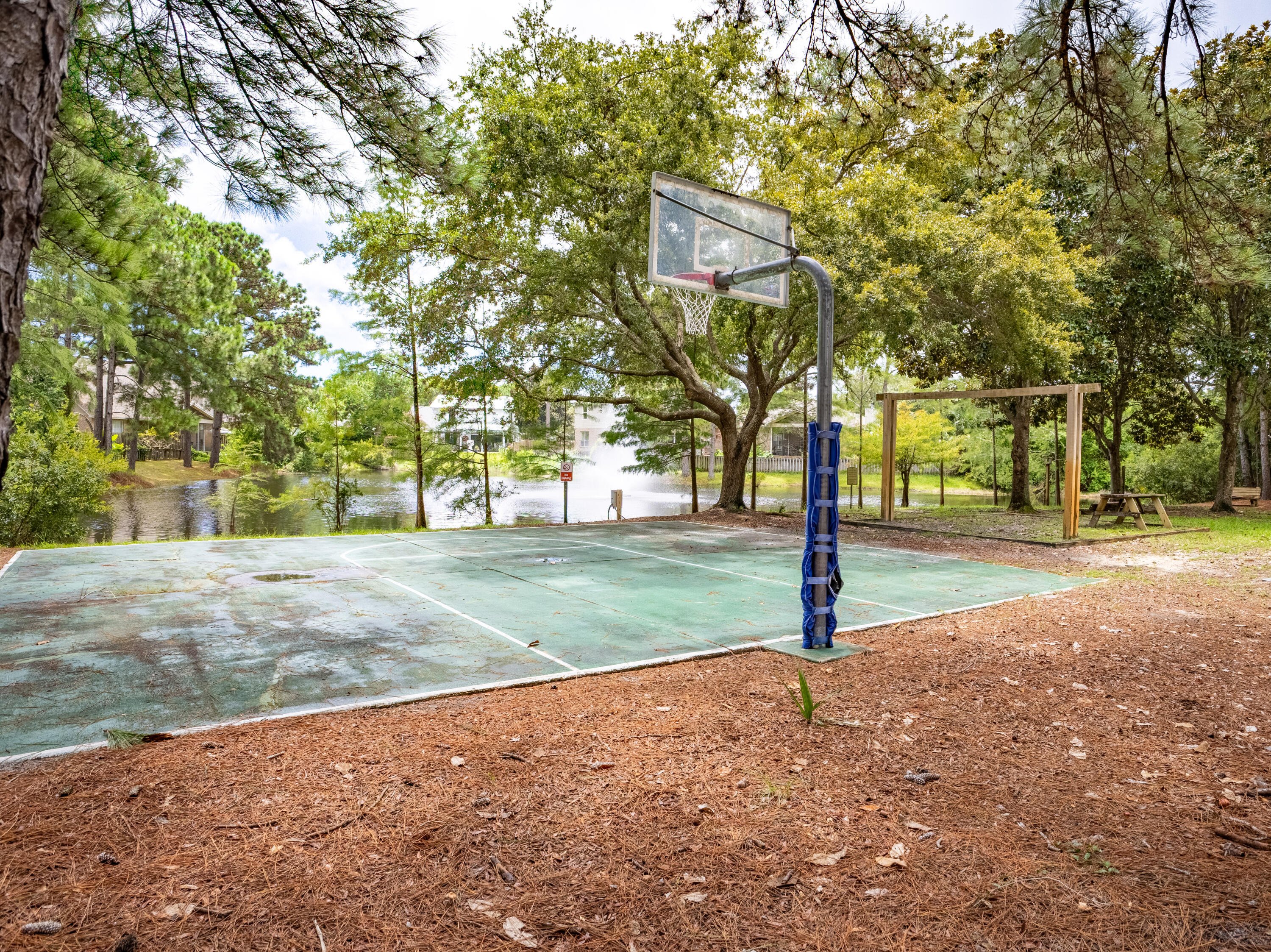 12 Corte Lago Santa Rosa Beach, FL 32459 - Photo 44 of 59 a street sign on a sidewalk next to a road