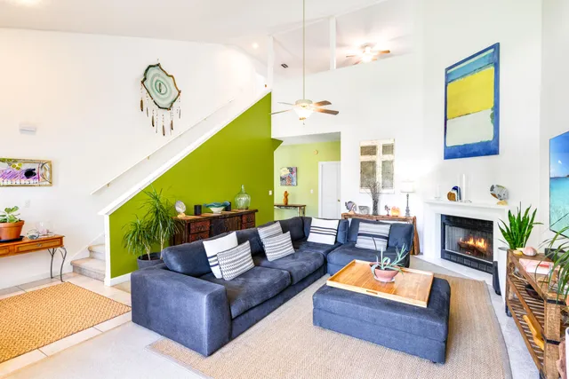 a living room with furniture fireplace and a flat screen tv