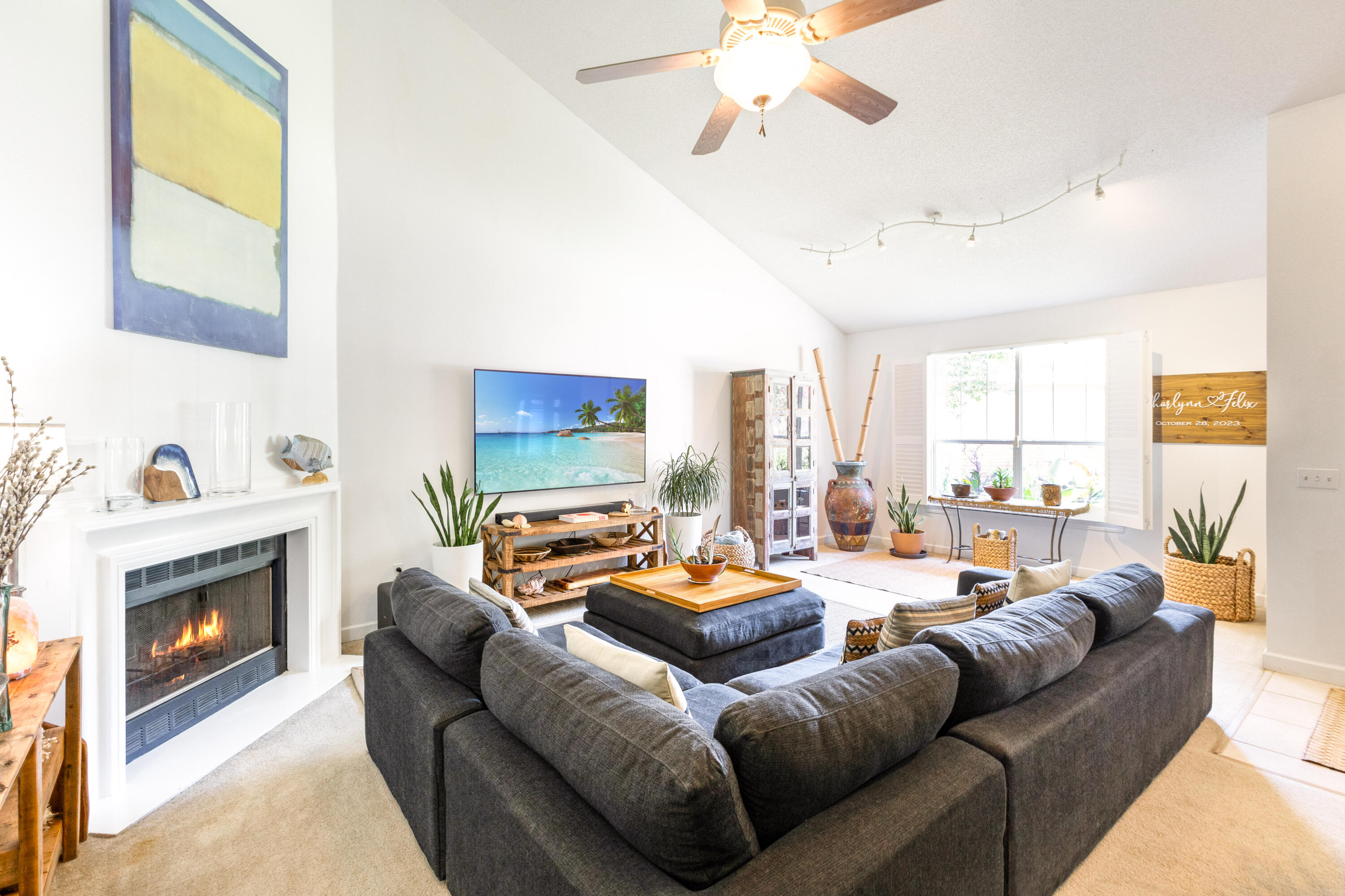 12 Corte Lago Santa Rosa Beach, FL 32459 - Photo 10 of 59 a living room with furniture a fireplace and a large window