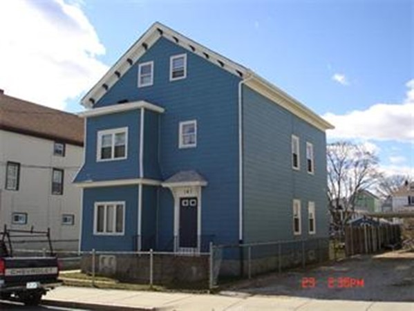 161 Mott Street Fall River, MA 02721 - Photo 1 of 24 a front view of a house with a yard