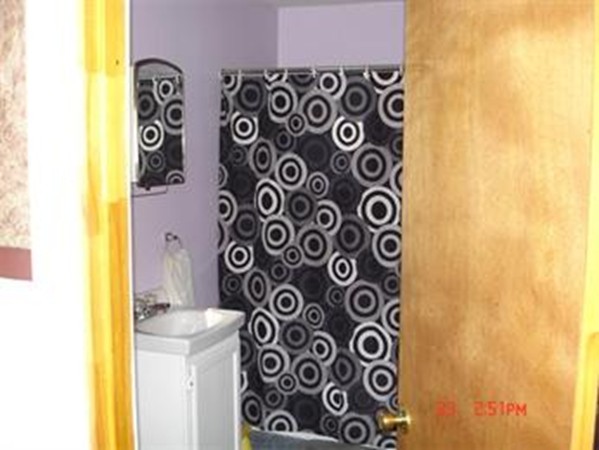 161 Mott Street Fall River, MA 02721 - Photo 17 of 24 a bathroom with a sink and a mirror