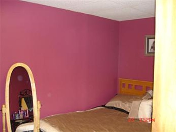 161 Mott Street Fall River, MA 02721 - Photo 20 of 24 a bedroom with a bed and a painting