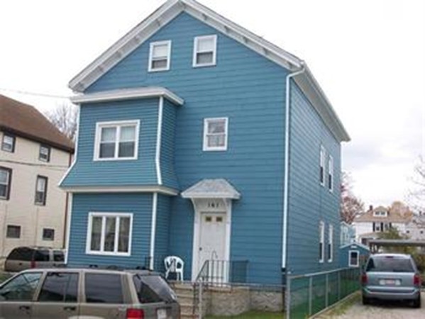 161 Mott Street Fall River, MA 02721 - Photo 9 of 24 a front view of a house with parking space