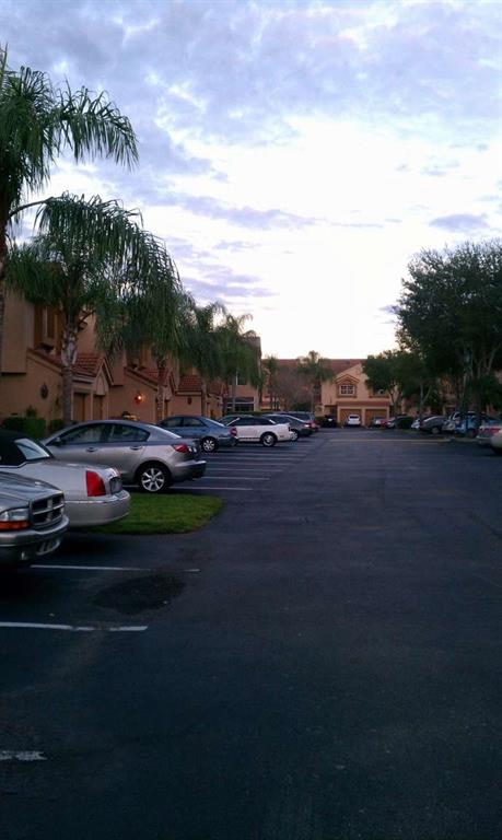 9395 Boca River Circle Boca Raton, FL 33434 - Photo 17 of 18 a cars parked on the side of the road